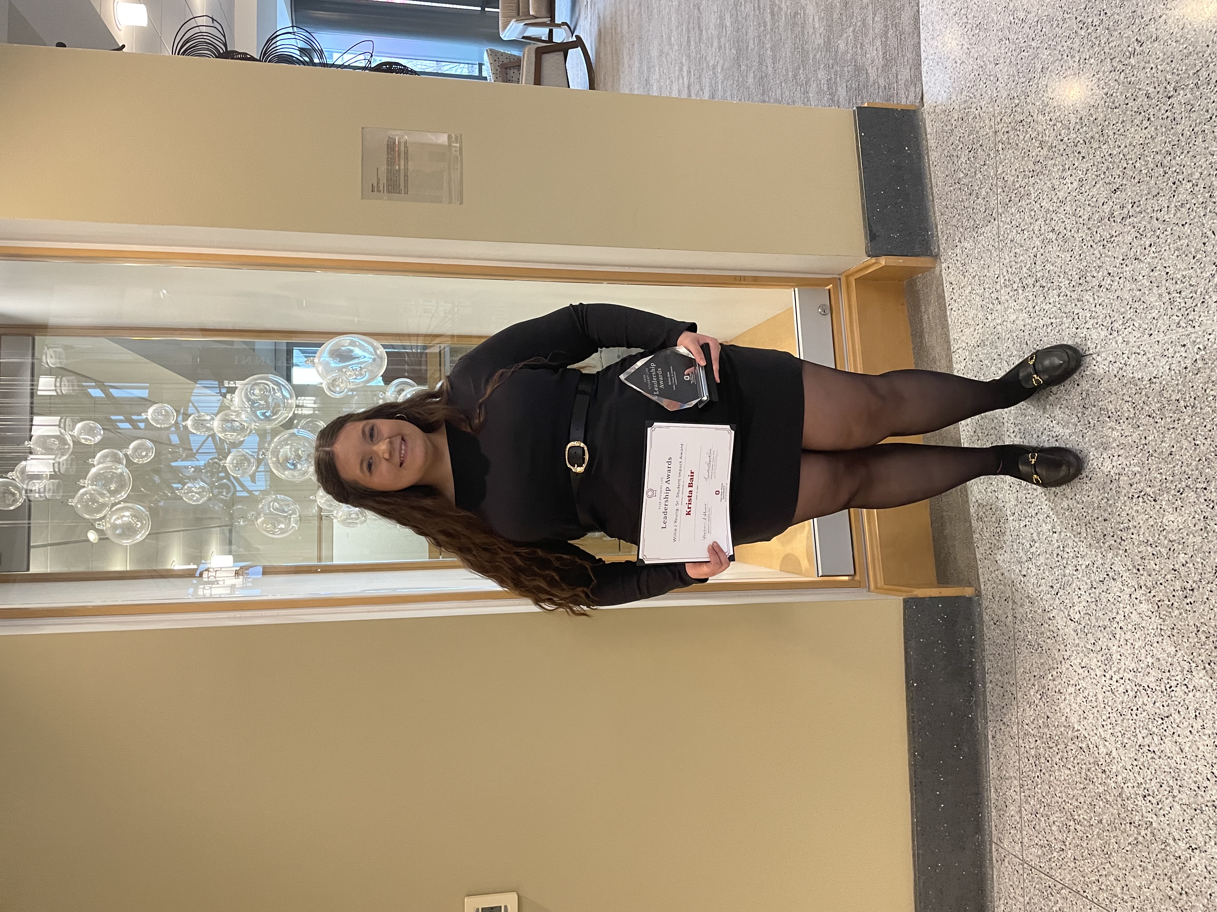 Krista Bair receiving the Willie J. Young Sr. Student Impact Award